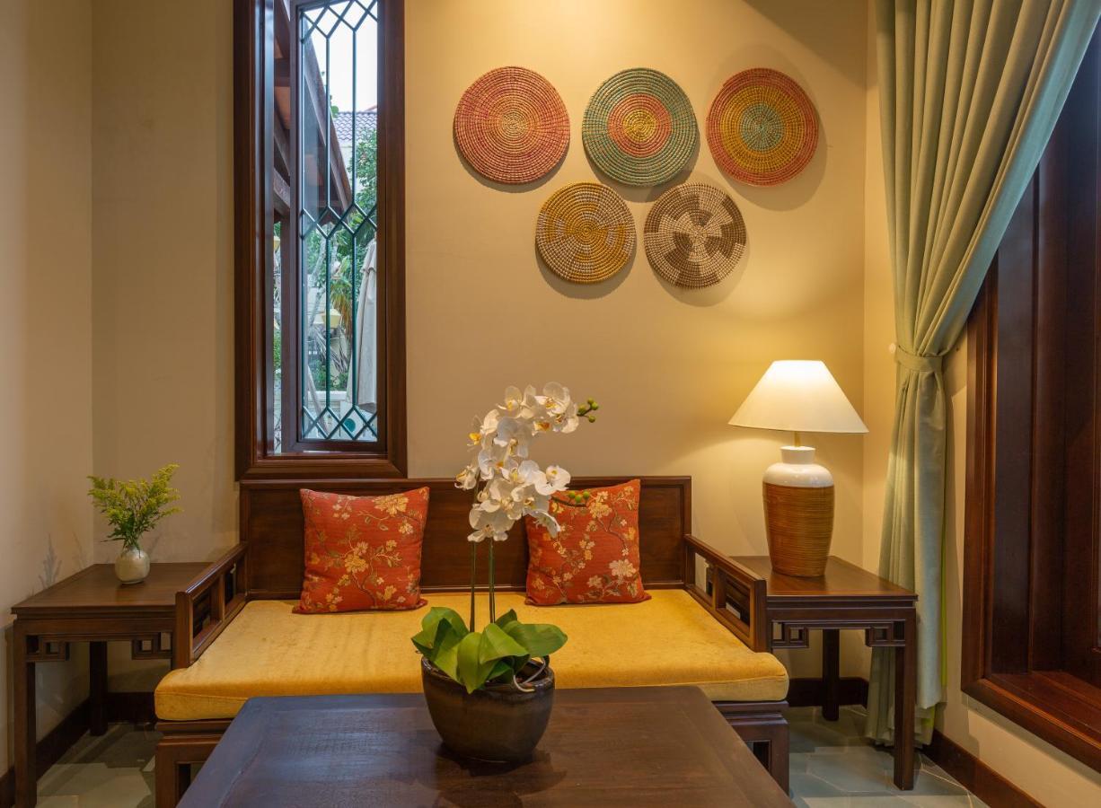 فندق بوتيك كوزي سافي هوي آن هوي ان المظهر الخارجي الصورة Interior of a suite at the hotel